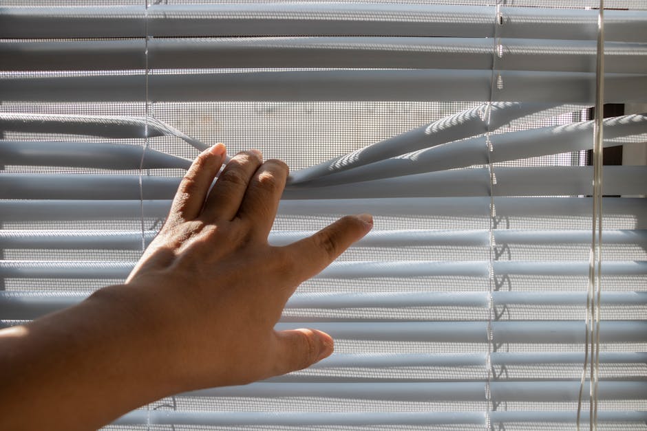Person smoothly opening a newly installed energy efficient double hung window