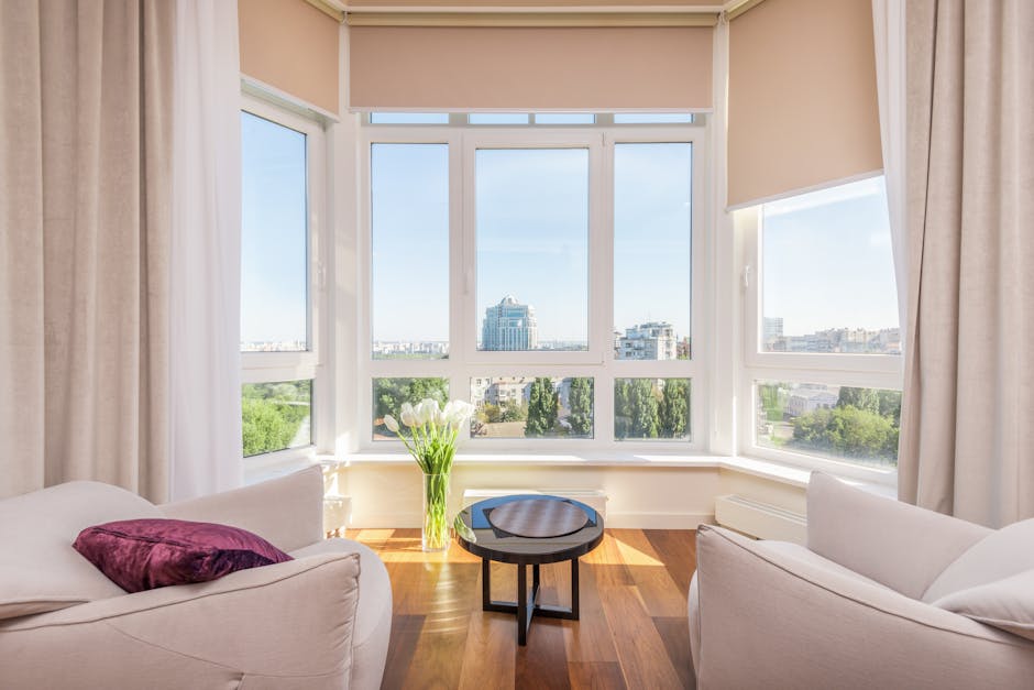 Bright living room interior showcasing premium vinyl replacement windows